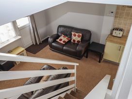 A living room with a sofa and coffee table at Turtle Chalet in Dawlish Warren