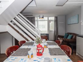 A dining room with a table and chairs at Dolphin Chalet Dawlish Warren