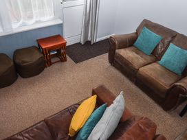 A living room with a sofa and coffee table at Dolphin Chalet in Dawlish Warren