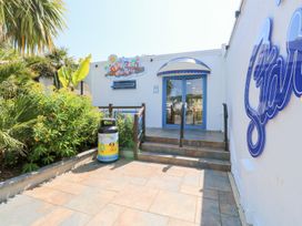 An entrance with stairs and plants at Dolphin Chalet in Dawlish Warren