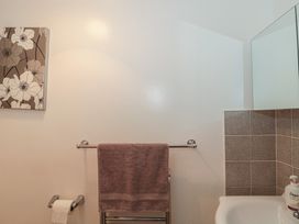 A bathroom with towel rack and soap at Breaking Waves in Burnham-On-Sea