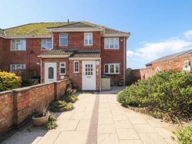 A house with a front door and pathway at Breaking Waves in Burnham-On-Sea