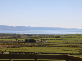 A view of fields and mountains by the sea at Ty Coch, Llanaelhaearn near Trefor, Caernarfon