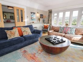 A living room with sofas and a coffee table at Pengwern in Llanrwst