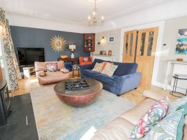 A living room with furniture including sofas and a coffee table at Pengwern in Llanrwst