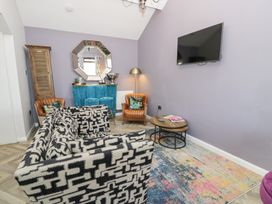A living room with a coffee table and sofa at Pengwern in Llanrwst