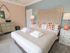 A bedroom with a bed and bedside tables at Pengwern in Llanrwst