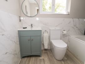 A bathroom with a vanity unit and toilet at Pengwern in Llanrwst