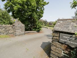A stone entrance with a sign at Pengwern in Llanrwst