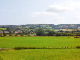 A view of green fields and hills at Pengwern in Llanrwst