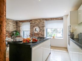 A kitchen with a countertop and window at 9 The Pottery in Dartmouth