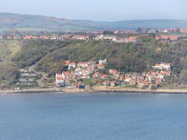 A coastal view with houses and hills at Voebroch in Lythe