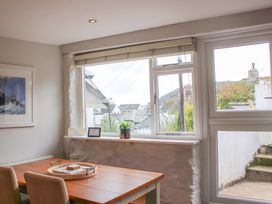 A dining room with a window and a table at Simples in Dartmouth