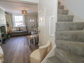 A living room with a sofa and coffee table at Heath Cottage Stratford-Upon-Avon