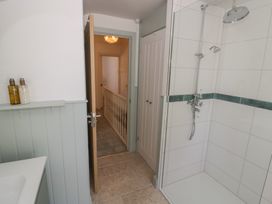 A bathroom with a shower and sink at Heath Cottage Stratford-Upon-Avon