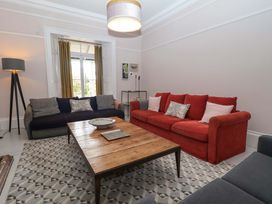 A living room with sofas and a coffee table at Barnsley House in Teignmouth