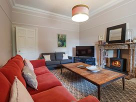 A living room with a sofa and coffee table at Barnsley House in Teignmouth