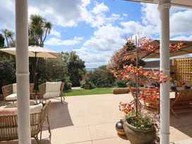 A garden with outdoor furniture and plants at Barnsley House Teignmouth