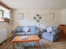 A living room with a sofa and coffee table at The Old Bakery in South Perrott near Mosterton