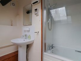 A bathroom with a sink and shower at The Old Bakery South Perrott near Mosterton