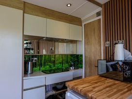 A kitchen with a kettle and a stove at The Fox Den in Nantmel near Rhayader