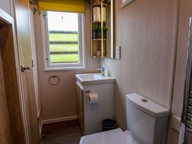 A bathroom with a sink and toilet at The Fox Den Nantmel near Rhayader