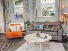 A living room with a sofa and armchair at Ferndale in Lynton