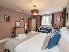A bedroom with a bed and wardrobe at Ferndale in Lynton
