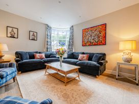 A living room with sofas and a coffee table at Home Farmhouse at the Graythwaite Estate near Hawkshead