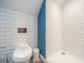 A bathroom with a toilet and shower at Home Farmhouse at the Graythwaite Estate near Hawkshead
