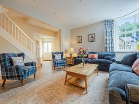 A living room with seating and a coffee table at Home Farmhouse at the Graythwaite Estate near Hawkshead