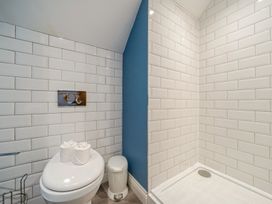 A bathroom with a toilet and shower at Home Farmhouse at the Graythwaite Estate near Hawkshead