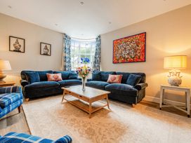 A living room with sofas and a coffee table at Home Farmhouse at the Graythwaite Estate near Hawkshead