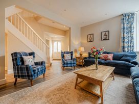 A living room with a sofa and armchairs at Home Farmhouse at the Graythwaite Estate near Hawkshead