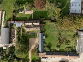 An outdoor area with garden and outbuildings at Reybridge House in Lacock