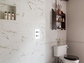 A bathroom with a shower and toilet at Reybridge House in Lacock