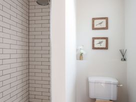 A bathroom with a shower and toilet at Reybridge House in Lacock