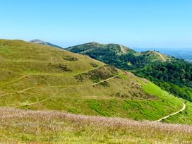 A view of hills and paths in a landscape at The Escape in Malvern