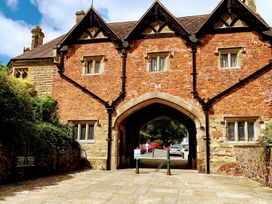 A brick building with archway at The Escape in Malvern