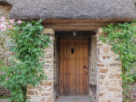 An entrance with a wooden door and plants at Garden View in Wellington