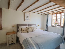 A bedroom with a bed and a window at Garden View in Wellington