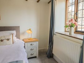 A bedroom with a bed and lamp at Garden View in Wellington