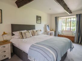 A bedroom with a bed and a window at Garden View in Wellington