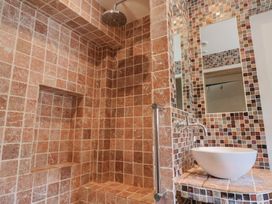 A bathroom with a shower and a sink at Garden View in Wellington