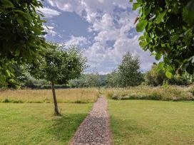 A pathway surrounded by trees in the garden at Garden View Wellington