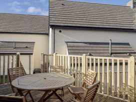 A table and chairs on a patio at Summer Rose in Craster
