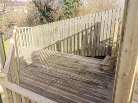 An outdoor wooden deck area at Summer Rose in Craster