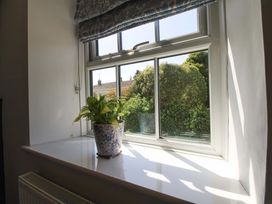 A window with a plant on the sill at 3 Rock Cottages in Kingston