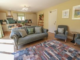 A living room with a sofa and armchairs at Ardlochan Lodge - Culzean Castle in Maybole