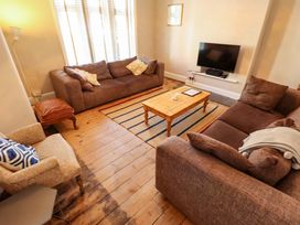 A living room with a coffee table and sofas at Maples in Hunstanton
